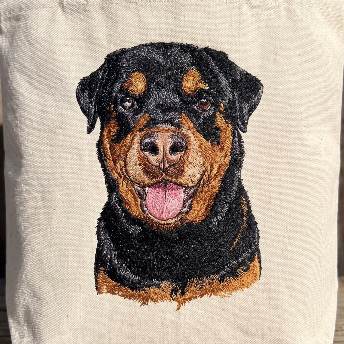 The same Rottweiler embroidered on a cream canvas tote
